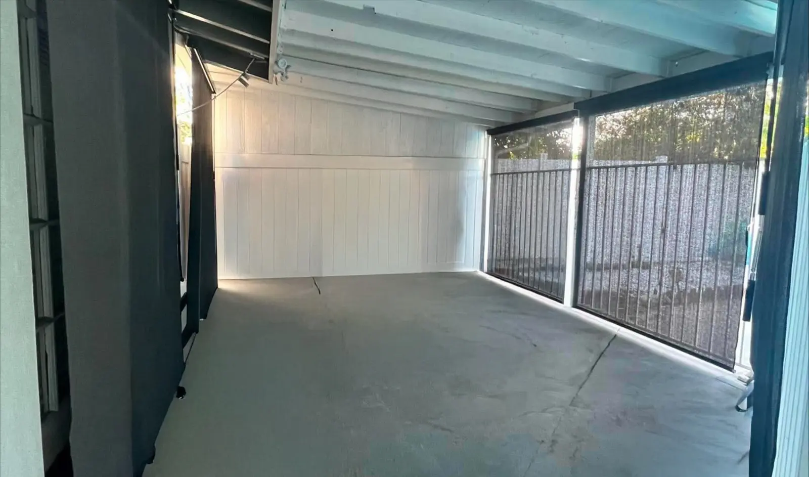 Empty covered patio before the gym build